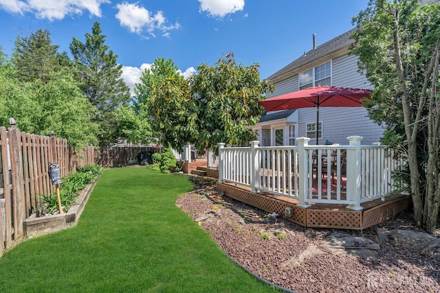 view of yard with a wooden deck