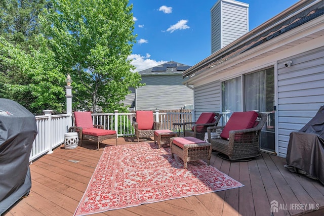 wooden terrace featuring area for grilling