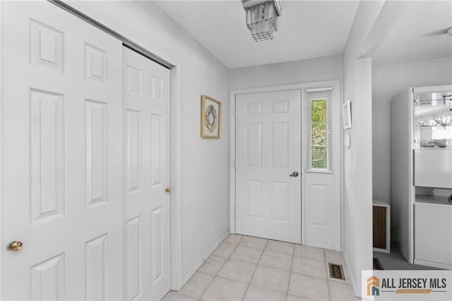 29 Ethan Allen Dr Unit B, Monroe, NJ 08831 - foyer with baseboards and light tile patterned floors