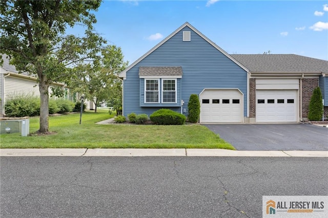 29 Ethan Allen Dr Unit B, Monroe, NJ 08831 - view of front of property with an attached garage, asphalt driveway, a front yard, and brick siding