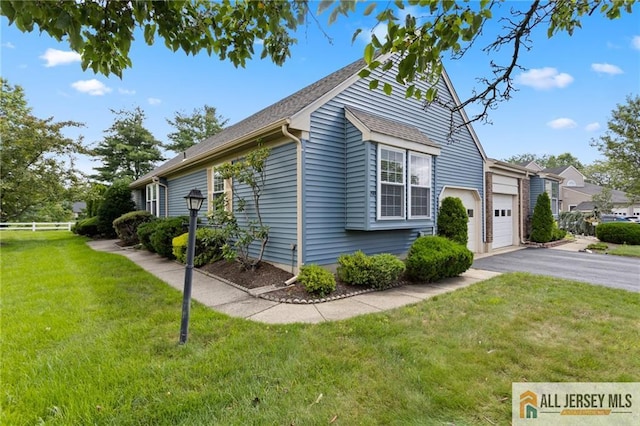 29 Ethan Allen Dr Unit B, Monroe, NJ 08831 - view of side of property with a garage and asphalt driveway