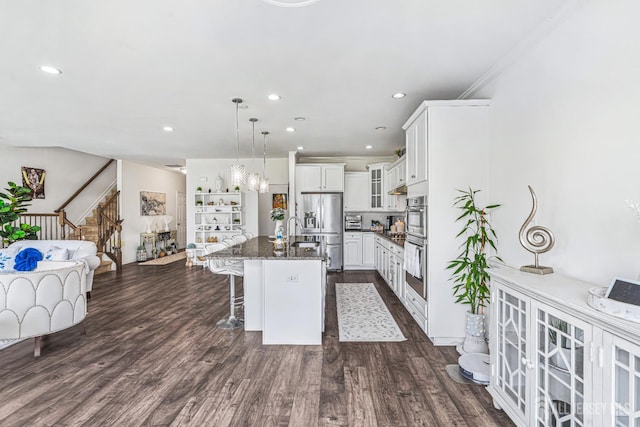 18 Larkspur Ln, Monroe, NJ 08831 - kitchen featuring appliances with stainless steel finishes, a breakfast bar area, recessed lighting, an island with sink, and open floor plan