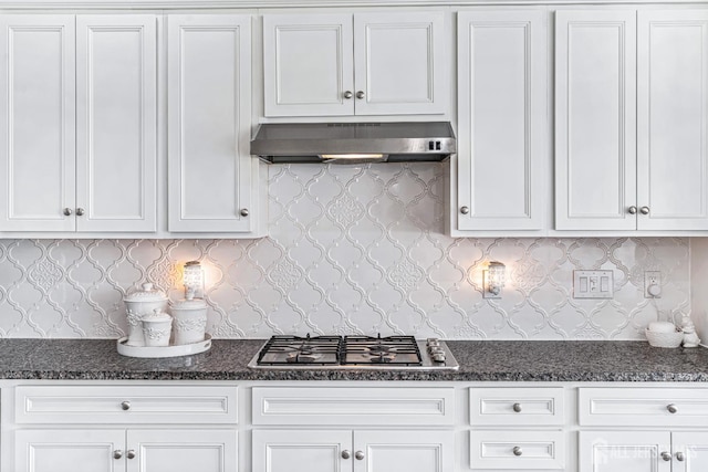 18 Larkspur Ln, Monroe, NJ 08831 - kitchen with under cabinet range hood, stainless steel gas cooktop, white cabinets, and dark stone countertops