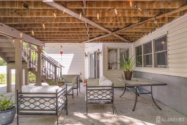 view of patio / terrace featuring outdoor lounge area and stairs