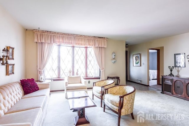 living area featuring light colored carpet