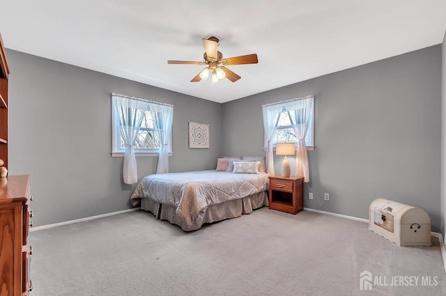 bedroom with carpet, baseboards, and a ceiling fan