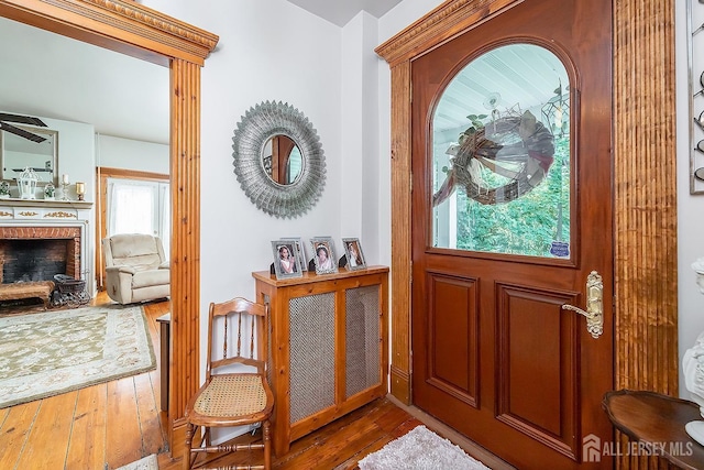 234 W Church St, Gloucester Twp, NJ 08012 - entrance foyer with a fireplace and hardwood / wood-style flooring