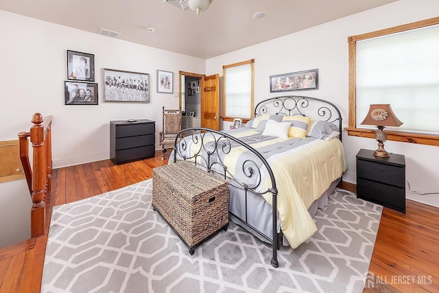 234 W Church St, Gloucester Twp, NJ 08012 - bedroom featuring baseboards, visible vents, and hardwood / wood-style floors