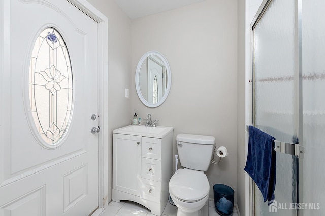 234 W Church St, Gloucester Twp, NJ 08012 - bathroom featuring vanity, an enclosed shower, tile patterned floors, and toilet