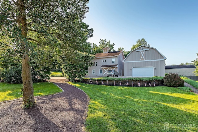 234 W Church St, Gloucester Twp, NJ 08012 - view of front of home featuring a front yard, an outdoor structure, a chimney, and a detached garage