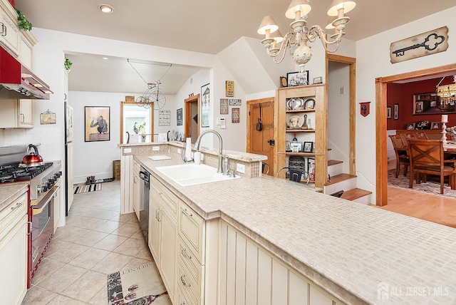 234 W Church St, Gloucester Twp, NJ 08012 - kitchen featuring a sink, appliances with stainless steel finishes, a notable chandelier, and cream cabinets