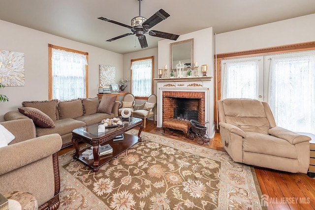 234 W Church St, Gloucester Twp, NJ 08012 - living room with a brick fireplace, a ceiling fan, and wood finished floors