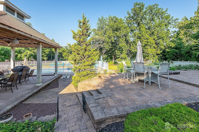 234 W Church St, Gloucester Twp, NJ 08012 - view of patio / terrace with a fenced in pool, outdoor dining area, and fence