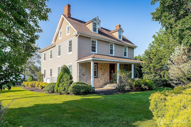 234 W Church St, Gloucester Twp, NJ 08012 - view of front of property with a chimney, a porch, stone siding, and a front yard