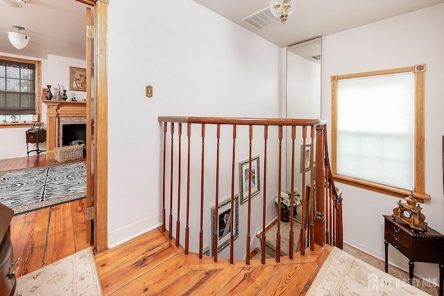 234 W Church St, Gloucester Twp, NJ 08012 - hallway featuring baseboards, visible vents, and wood finished floors