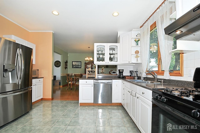 1329 Crown Ln, South Plainfield, NJ 07080 - kitchen featuring stainless steel appliances, range hood, white cabinetry, a peninsula, and glass insert cabinets