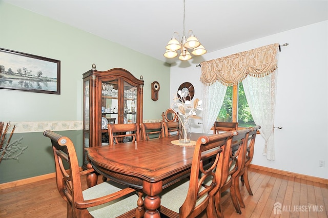 1329 Crown Ln, South Plainfield, NJ 07080 - dining area with a chandelier and light wood-style floors