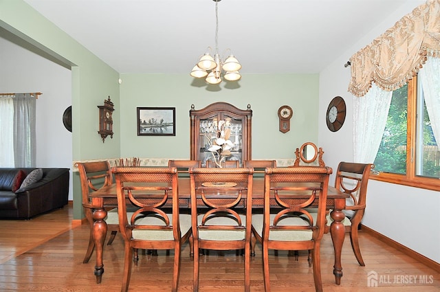 1329 Crown Ln, South Plainfield, NJ 07080 - dining area featuring a chandelier and hardwood / wood-style flooring