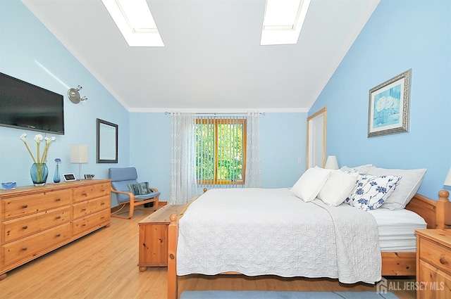 1329 Crown Ln, South Plainfield, NJ 07080 - bedroom with a skylight, lofted ceiling, and light wood-style flooring
