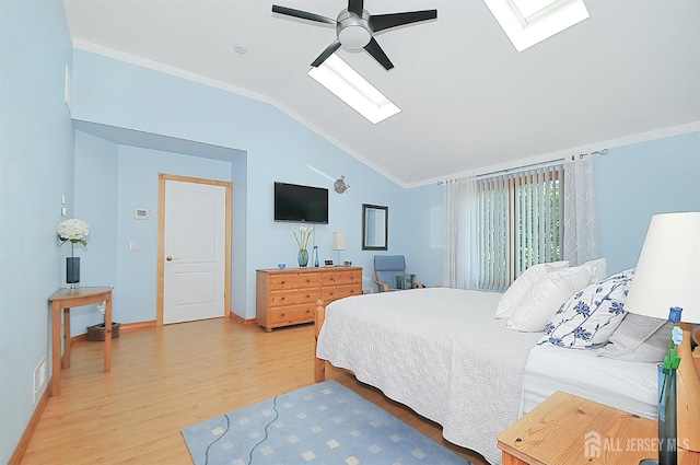 1329 Crown Ln, South Plainfield, NJ 07080 - bedroom featuring a skylight, vaulted ceiling, light wood-style flooring, crown molding, and ceiling fan