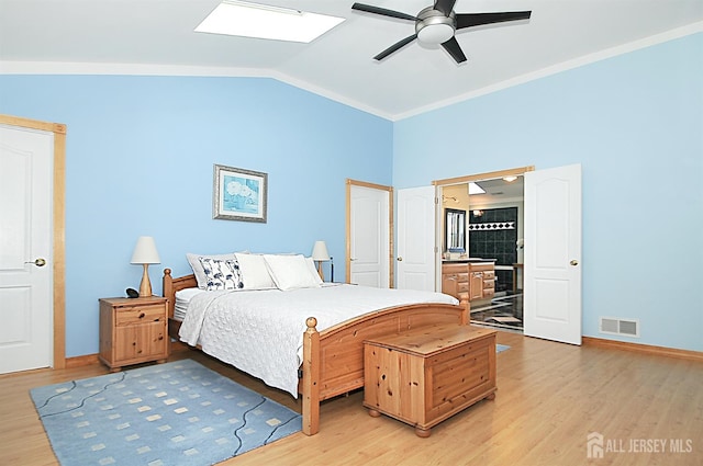 1329 Crown Ln, South Plainfield, NJ 07080 - bedroom with light wood-style flooring, lofted ceiling, a skylight, crown molding, and a ceiling fan