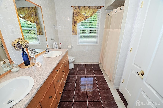 1329 Crown Ln, South Plainfield, NJ 07080 - bathroom with tile walls, double vanity, tile patterned flooring, healthy amount of natural light, and curtained shower