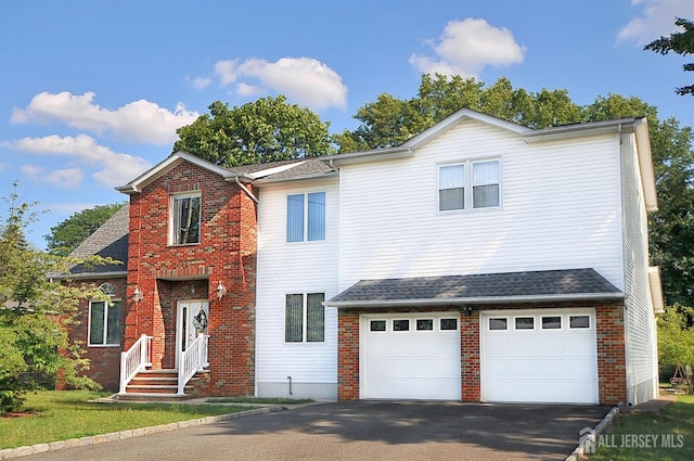 1329 Crown Ln, South Plainfield, NJ 07080 - traditional-style house featuring driveway, a garage, and brick siding