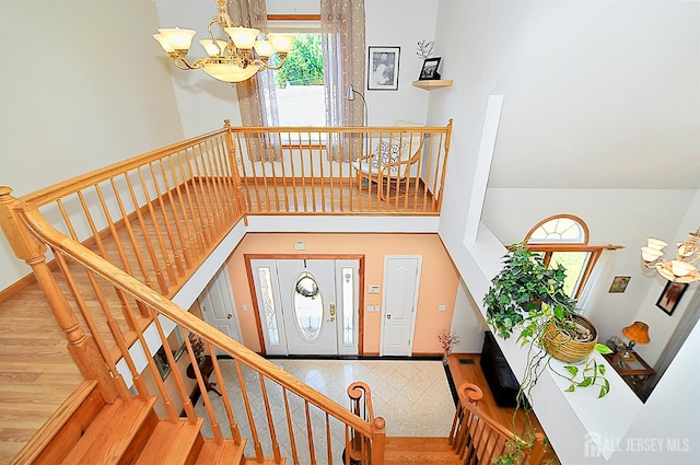1329 Crown Ln, South Plainfield, NJ 07080 - staircase with a chandelier and a towering ceiling