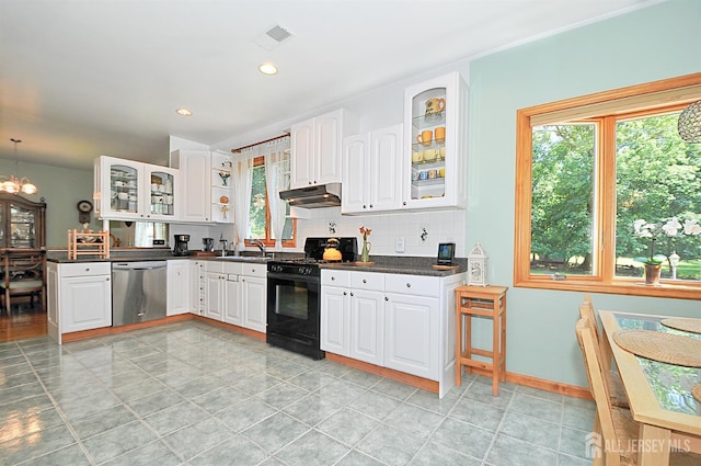 1329 Crown Ln, South Plainfield, NJ 07080 - kitchen featuring dark countertops, black gas range oven, tasteful backsplash, dishwasher, and glass insert cabinets