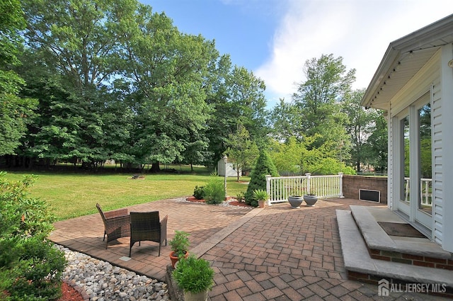 1329 Crown Ln, South Plainfield, NJ 07080 - view of patio / terrace with a storage unit