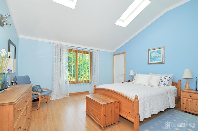 1329 Crown Ln, South Plainfield, NJ 07080 - bedroom with a skylight, lofted ceiling, light wood-type flooring, and ornamental molding
