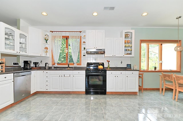 1329 Crown Ln, South Plainfield, NJ 07080 - kitchen with black gas range oven, dishwasher, tasteful backsplash, dark countertops, and range hood