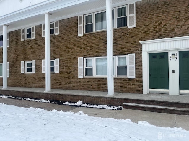 exterior space with brick siding