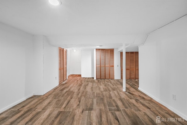 spare room with hardwood / wood-style flooring