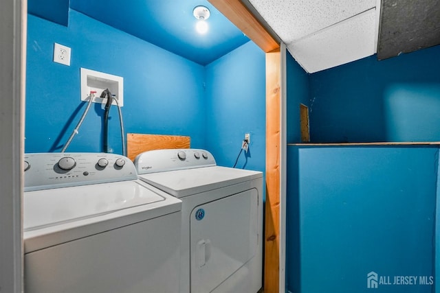 laundry room with washing machine and dryer