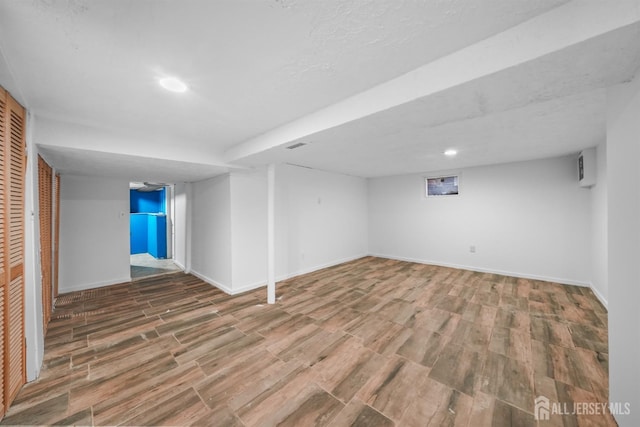 basement featuring hardwood / wood-style floors