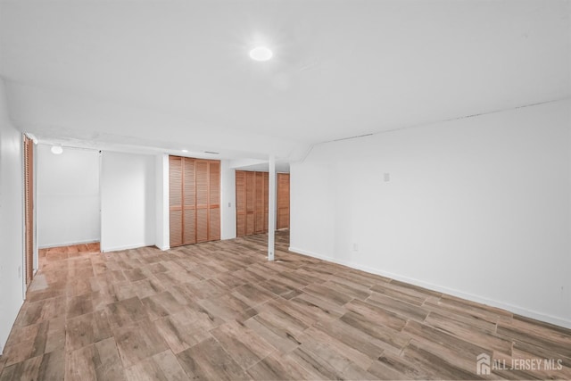 basement featuring light hardwood / wood-style flooring