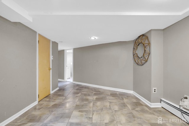 369 N Main St, Milltown, NJ 08850 - empty room with a baseboard heating unit and recessed lighting