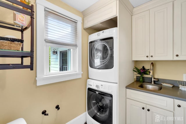 369 N Main St, Milltown, NJ 08850 - laundry room with stacked washer / drying machine and cabinet space