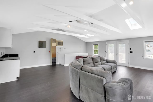 369 N Main St, Milltown, NJ 08850 - living room featuring a skylight, dark wood finished floors, and healthy amount of natural light