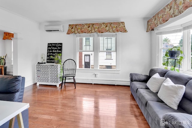 369 N Main St, Milltown, NJ 08850 - living area with an AC wall unit, plenty of natural light, a baseboard heating unit, wood finished floors, and ornamental molding