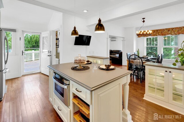 369 N Main St, Milltown, NJ 08850 - kitchen featuring healthy amount of natural light, hardwood / wood-style flooring, stainless steel appliances, hanging light fixtures, and recessed lighting