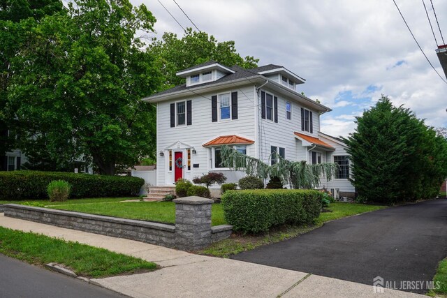 369 N Main St, Milltown, NJ 08850 - american foursquare style home featuring a front yard