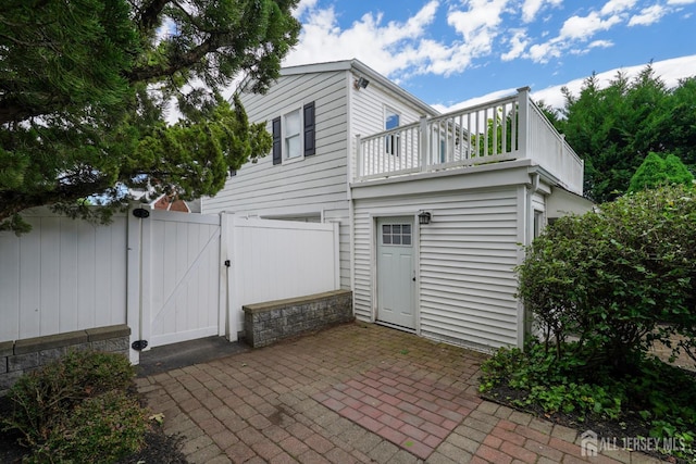 369 N Main St, Milltown, NJ 08850 - back of house with a gate, a patio area, and a balcony