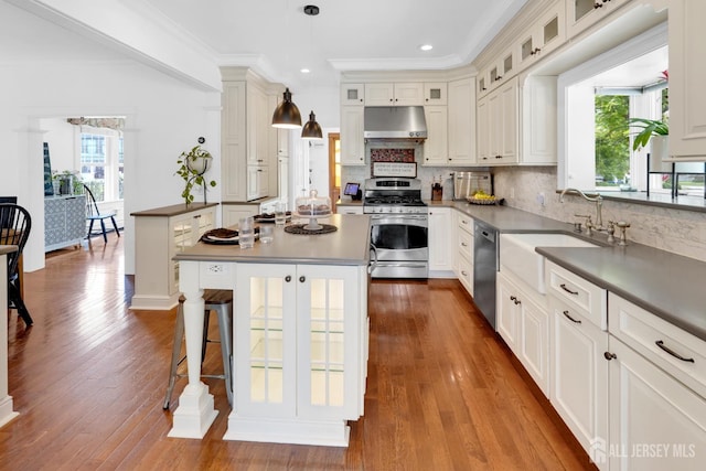 369 N Main St, Milltown, NJ 08850 - kitchen with stainless steel appliances, under cabinet range hood, a kitchen breakfast bar, dark wood finished floors, and recessed lighting
