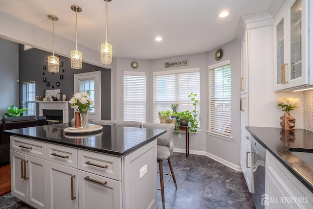 108 Jared Dr, North Brunswick, NJ 08902 - kitchen featuring a kitchen bar, stainless steel dishwasher, glass insert cabinets, white cabinets, and recessed lighting