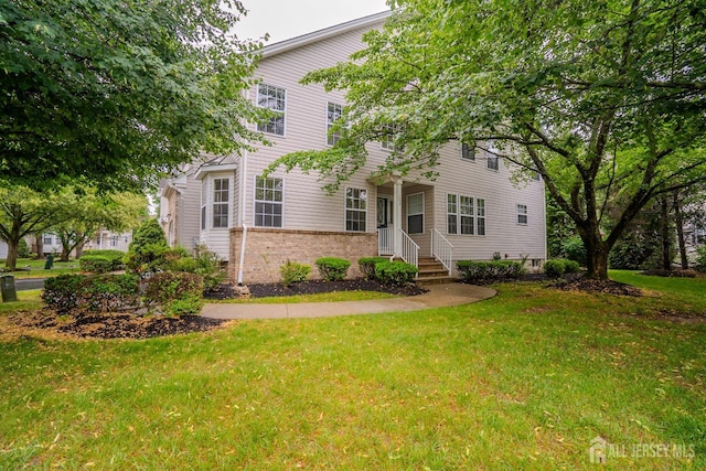 108 Jared Dr, North Brunswick, NJ 08902 - colonial inspired home with a front lawn and brick siding