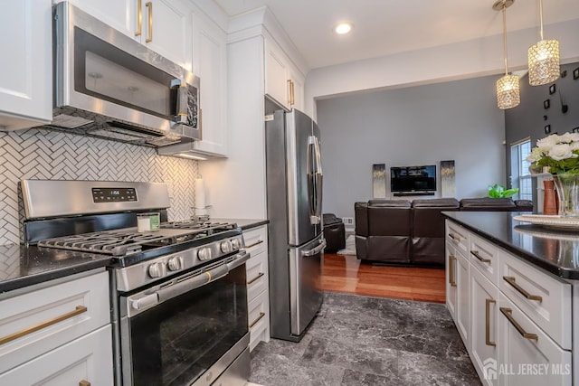 108 Jared Dr, North Brunswick, NJ 08902 - kitchen featuring stainless steel appliances, dark countertops, tasteful backsplash, white cabinetry, and recessed lighting