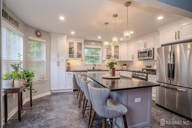 108 Jared Dr, North Brunswick, NJ 08902 - kitchen featuring appliances with stainless steel finishes, backsplash, white cabinetry, and recessed lighting