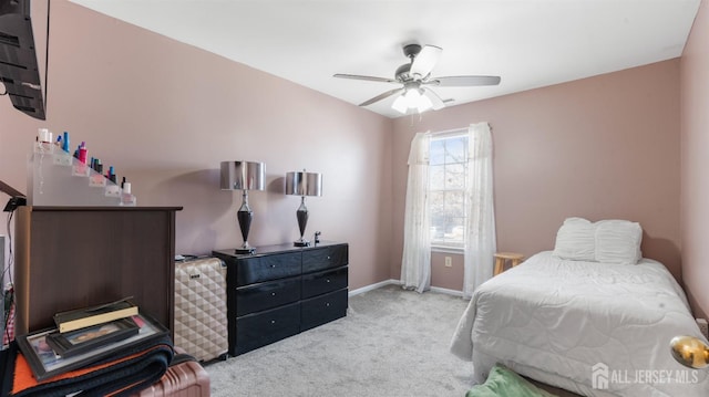 bedroom featuring a ceiling fan, carpet flooring, and baseboards